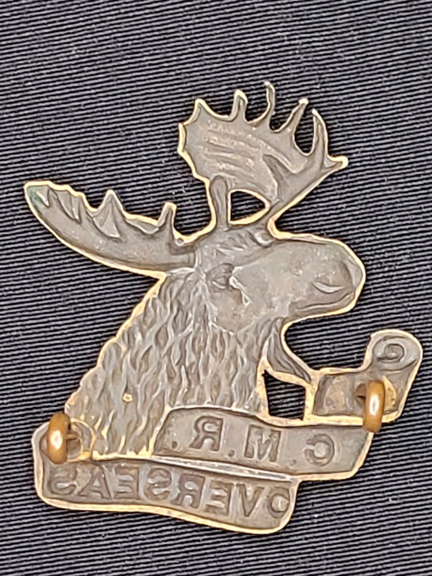 WW1 CEF 4th C.M.R. Cap Badge