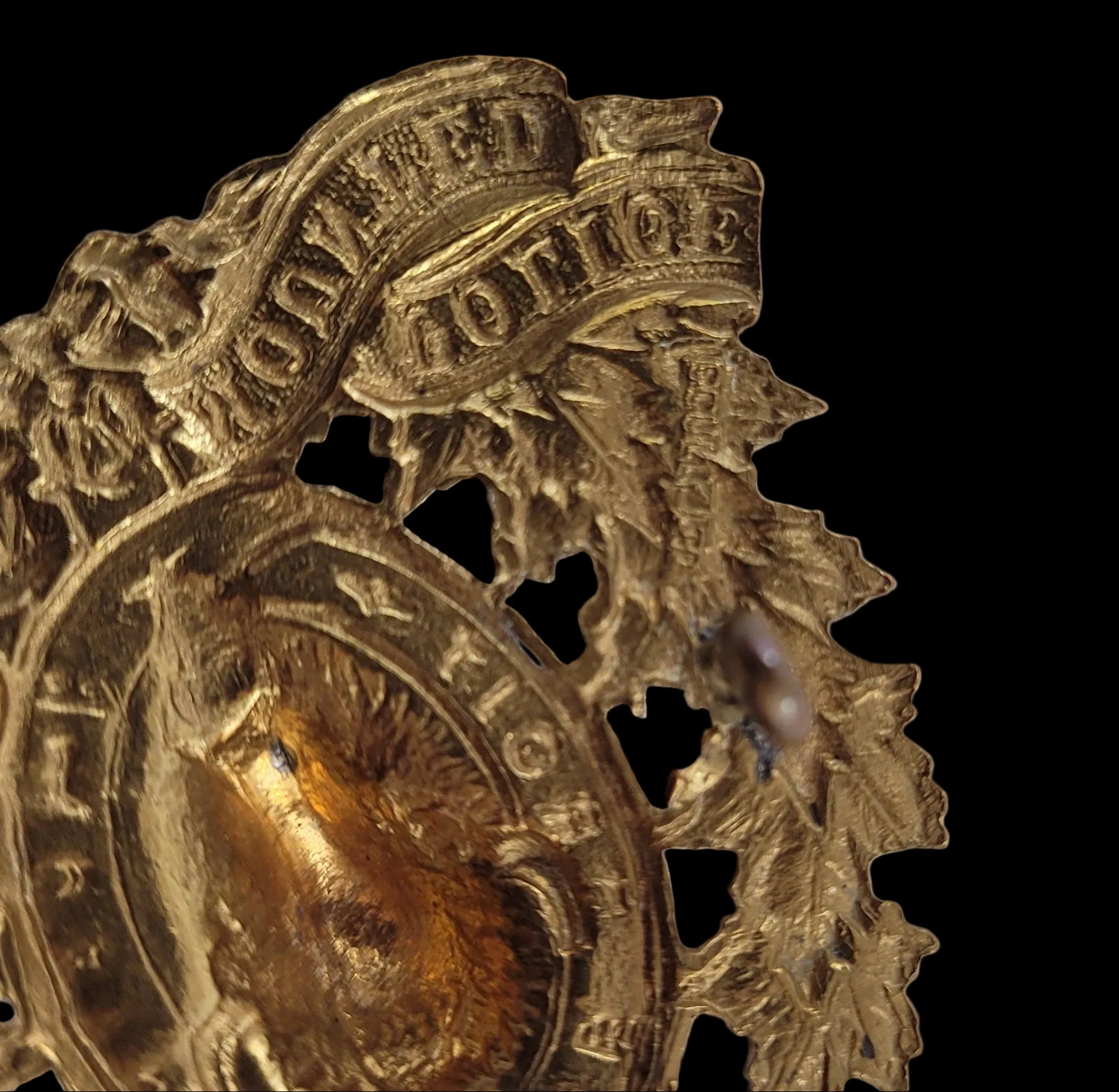 WW2-Era Cap Badge to the Royal Canadian Mounted Police mark
